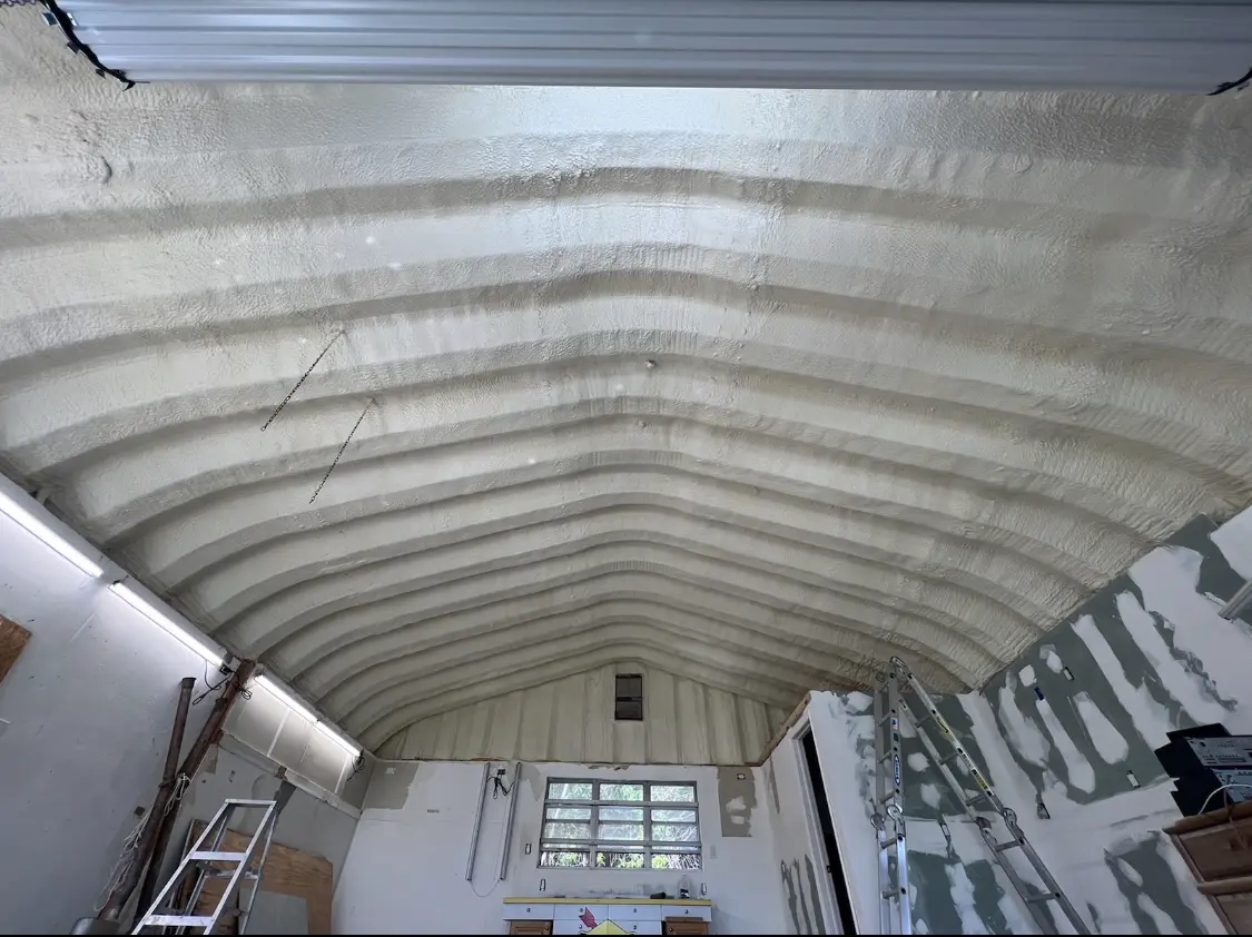 Spray polyurethane foam applied to the underside of a metal roof deck in Cranberry